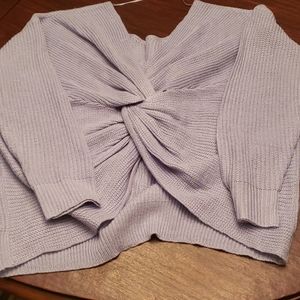 Light blue sweater with twist/know detail on back!